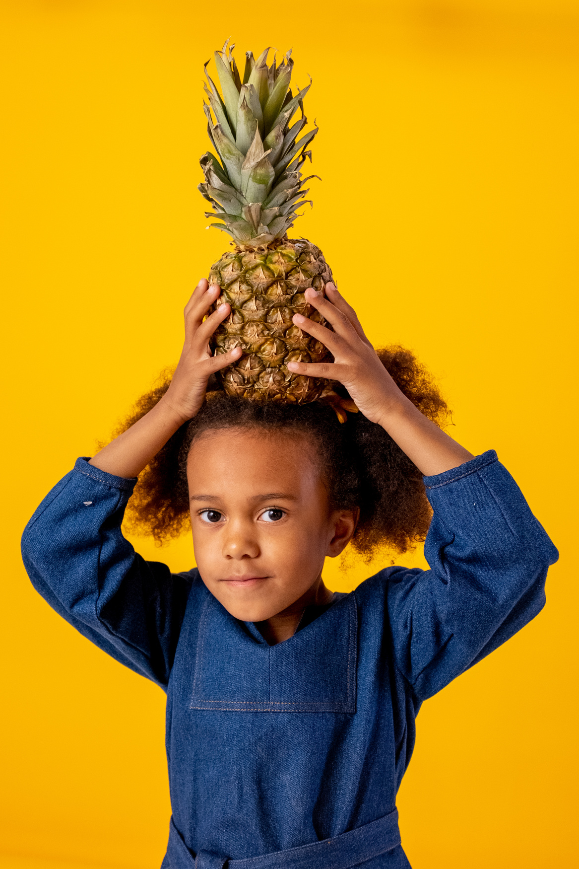 Boy in Blue Collared Shirt Holding Pineapple